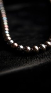 Elegant Black Pearl Necklace Aesthetic Wallpaper HD 4K for Mobile