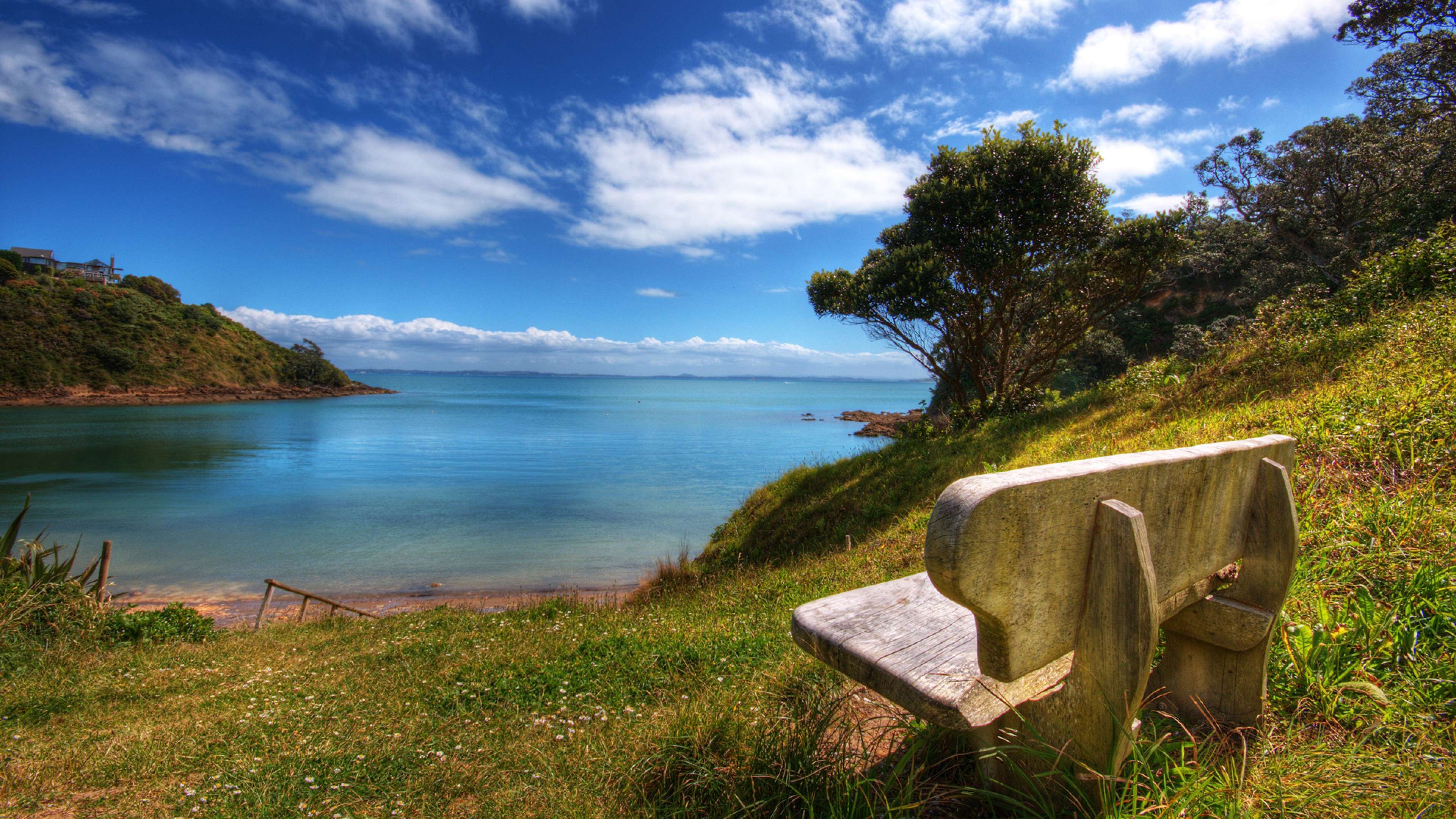 Scenic Coastal View Nature Wallpaper HD 4K - Aesthetic Bench by the Sea