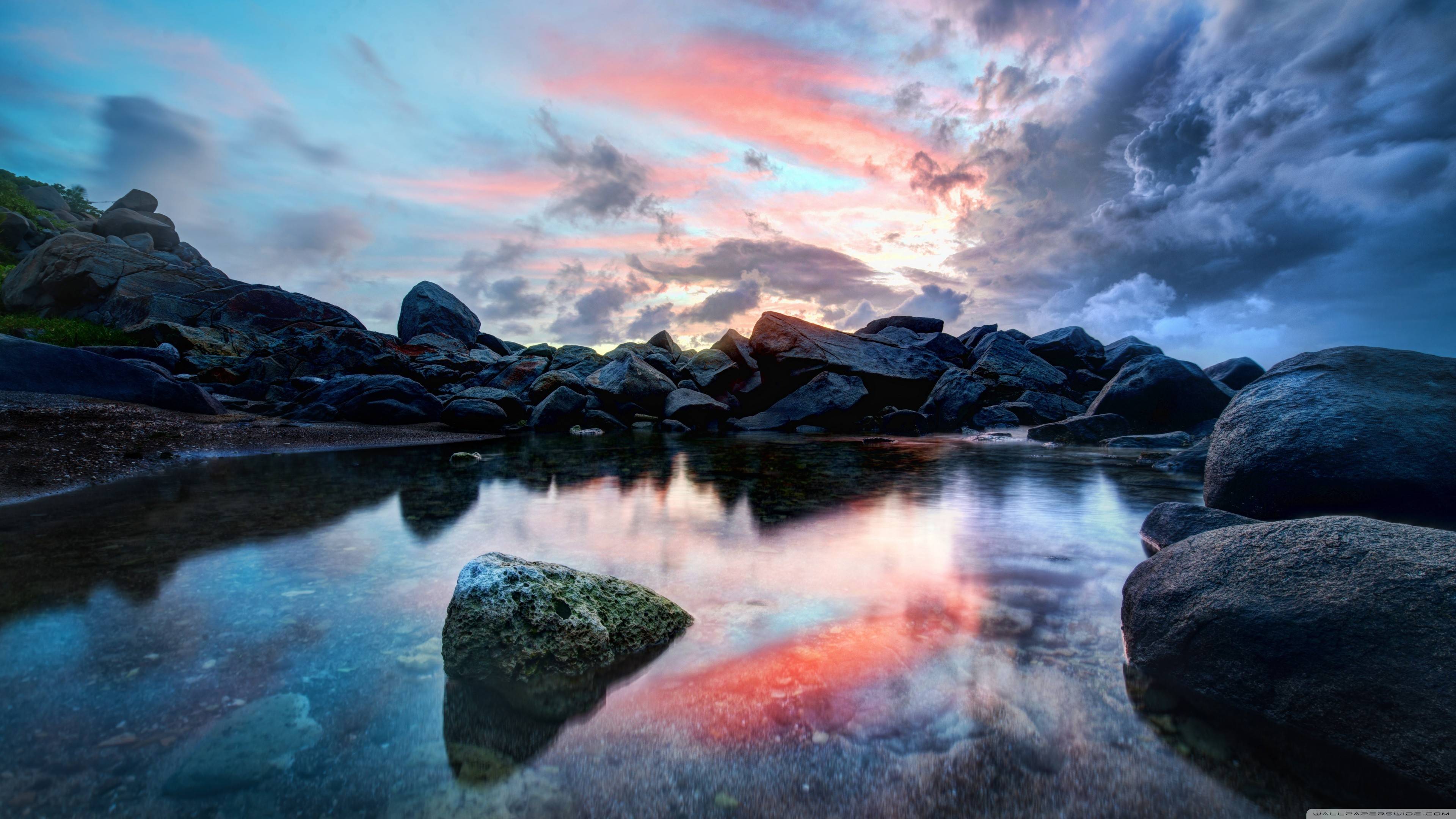 Dramatic Sunset Reflection over Rocky Beach Wallpaper HD 4K Aesthetic